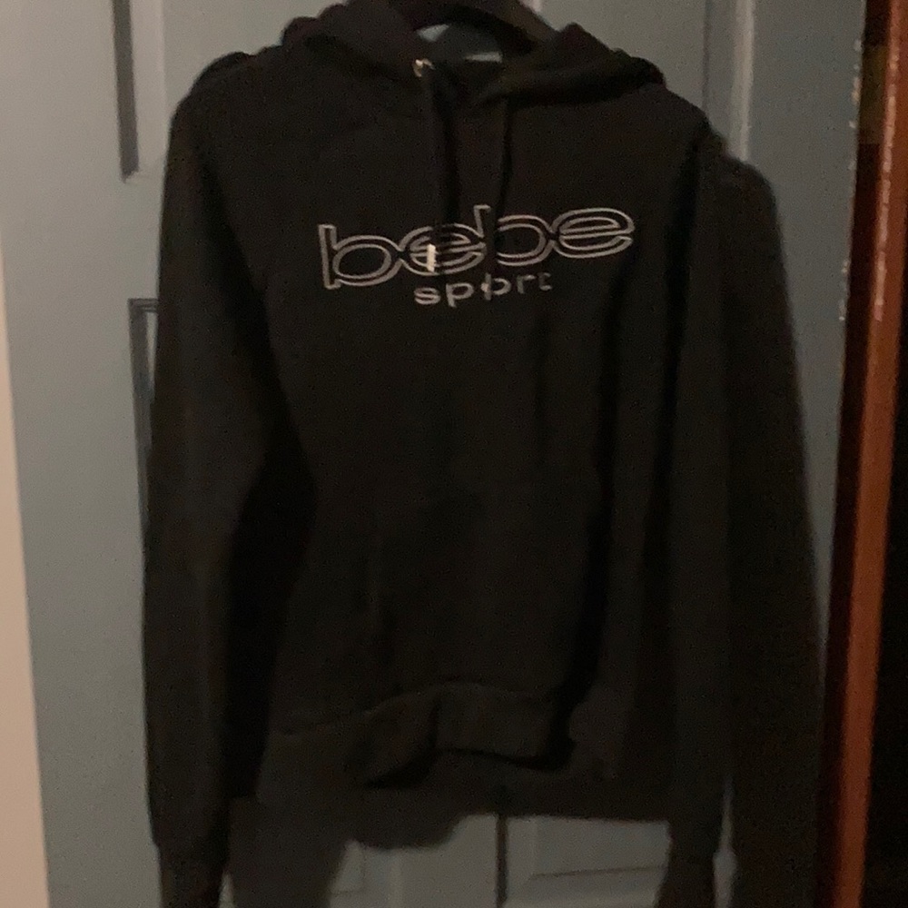 Women’s black Bebe size large hoodie.